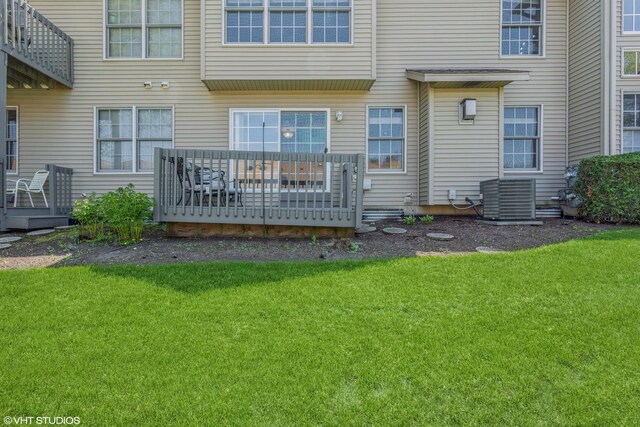 165 Mclaren Dr N, Sycamore, IL 60178 - rear view of property with a deck and a lawn