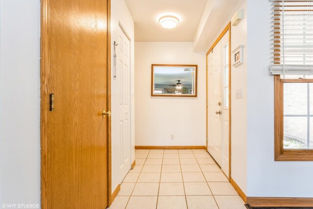 165 Mclaren Dr N, Sycamore, IL 60178 - corridor with baseboards and light tile patterned floors