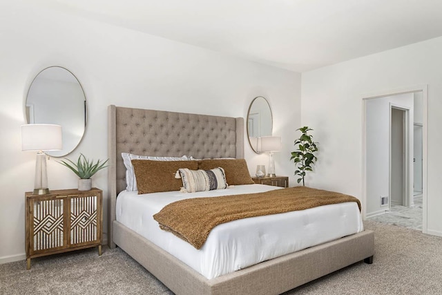 carpeted bedroom featuring baseboards