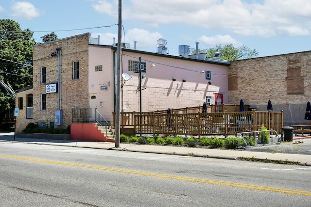view of property with fence