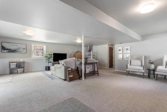 living area featuring baseboards and carpet flooring