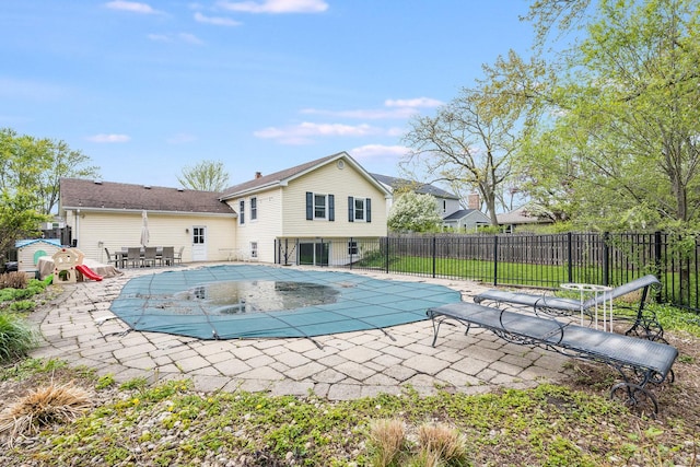 view of pool featuring a patio area, a fenced in pool, and fence