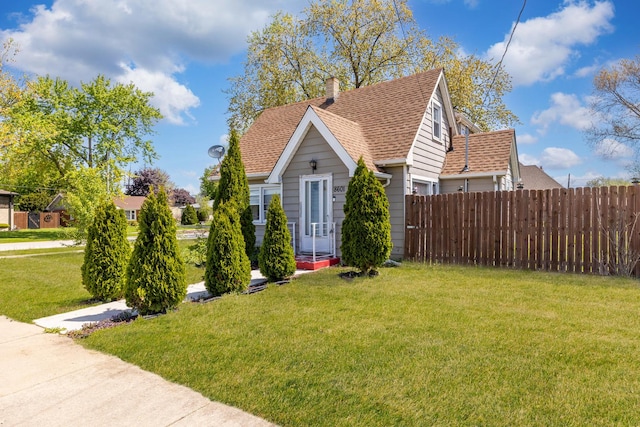view of front of home featuring a shingled roof and a chimney