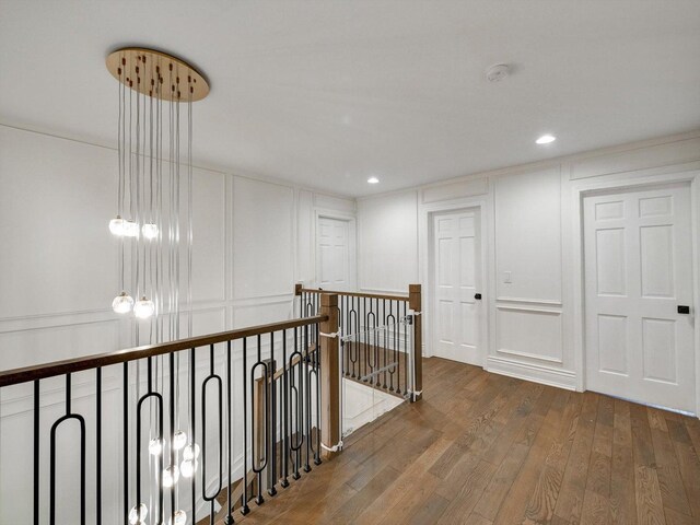 8 Wyndham Ct, Oak Brook, IL 60523 - corridor featuring a decorative wall, hardwood / wood-style floors, an upstairs landing, and recessed lighting