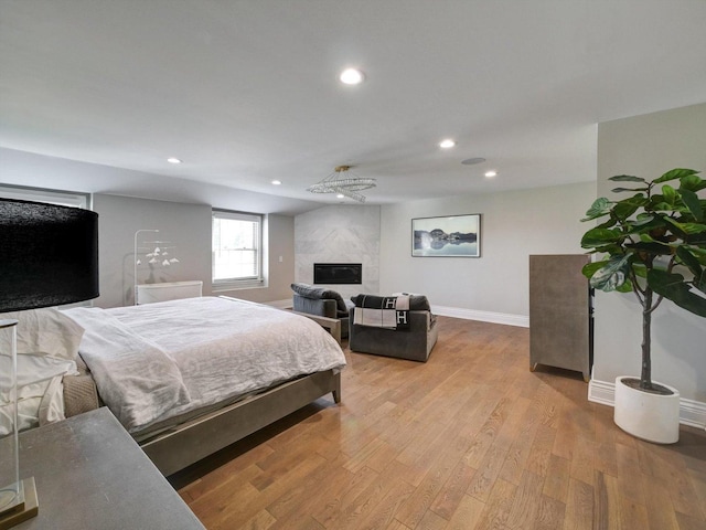 8 Wyndham Ct, Oak Brook, IL 60523 - bedroom featuring recessed lighting, wood finished floors, a premium fireplace, and baseboards