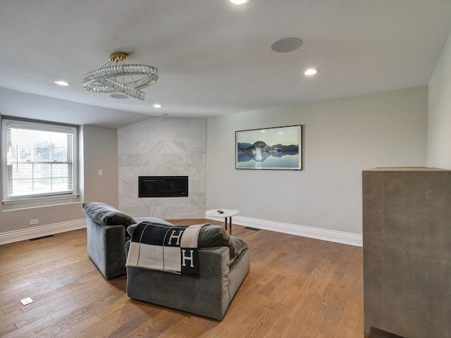 8 Wyndham Ct, Oak Brook, IL 60523 - living room featuring baseboards, a premium fireplace, wood finished floors, and recessed lighting