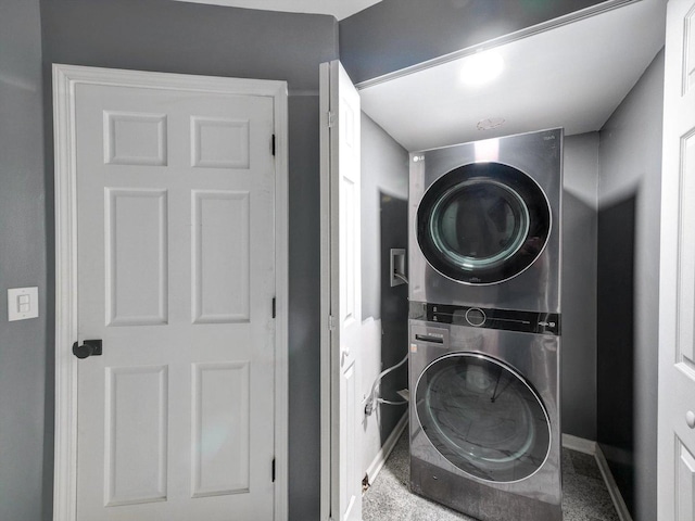 8 Wyndham Ct, Oak Brook, IL 60523 - clothes washing area with stacked washer / dryer and baseboards