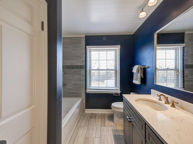 8 Wyndham Ct, Oak Brook, IL 60523 - full bath featuring plenty of natural light, vanity, baseboards, and toilet