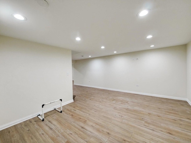 8 Wyndham Ct, Oak Brook, IL 60523 - finished basement with light wood-style flooring, baseboards, and recessed lighting