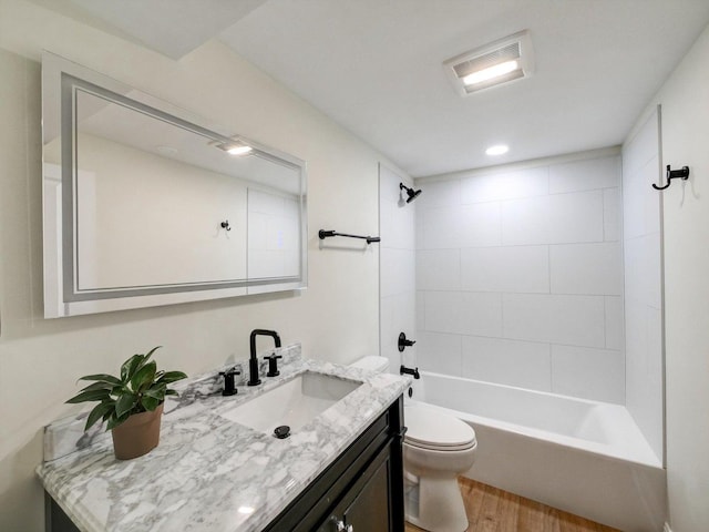 8 Wyndham Ct, Oak Brook, IL 60523 - bathroom featuring wood finished floors, toilet, vanity, and washtub / shower combination