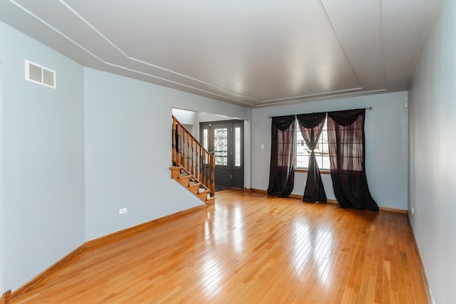 18034 Donatus Dr, Lansing, IL 60438 - spare room with stairway, baseboards, hardwood / wood-style floors, and visible vents
