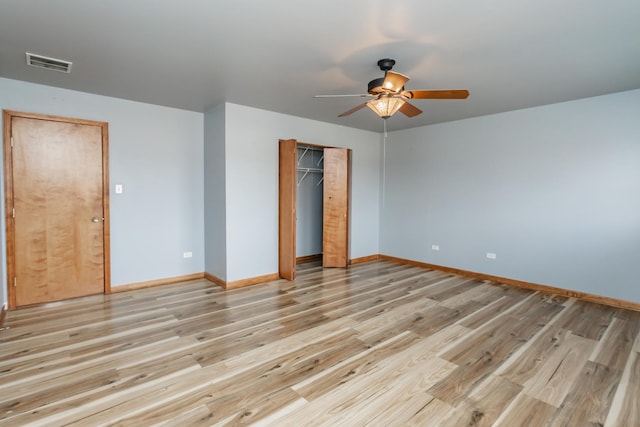 18034 Donatus Dr, Lansing, IL 60438 - unfurnished bedroom with a closet, visible vents, light wood-style flooring, and baseboards