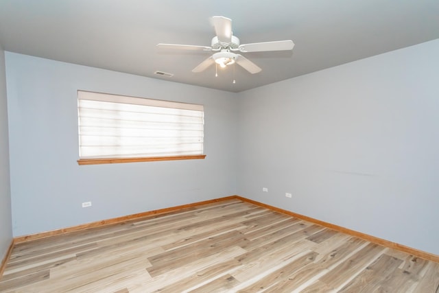 18034 Donatus Dr, Lansing, IL 60438 - unfurnished room with ceiling fan, light wood-style flooring, baseboards, and visible vents