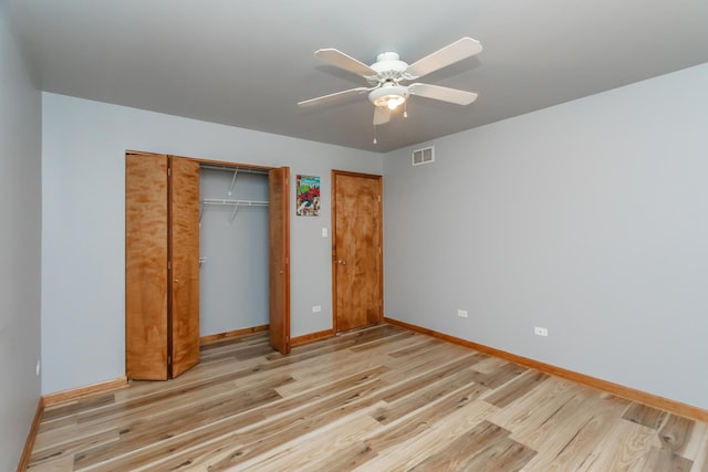 18034 Donatus Dr, Lansing, IL 60438 - unfurnished bedroom with baseboards, a closet, light wood-type flooring, and visible vents