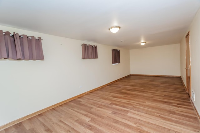 18034 Donatus Dr, Lansing, IL 60438 - spare room featuring light wood-style floors, visible vents, and baseboards