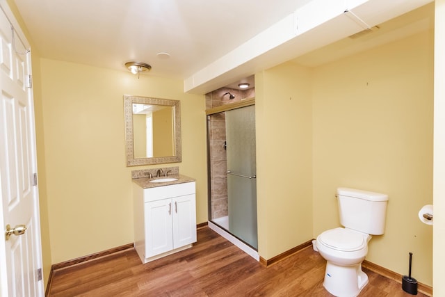 18034 Donatus Dr, Lansing, IL 60438 - bathroom featuring toilet, wood finished floors, a stall shower, baseboards, and vanity