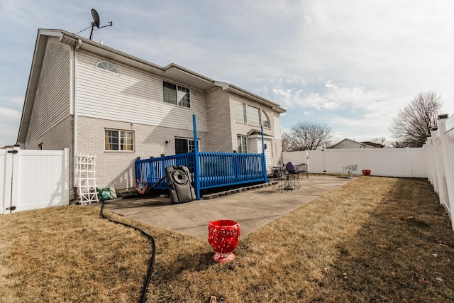 18034 Donatus Dr, Lansing, IL 60438 - rear view of property with a patio area, brick siding, a lawn, and a fenced backyard