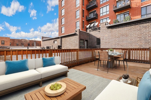 wooden deck with outdoor lounge area and outdoor dining space
