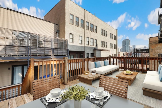 wooden deck featuring outdoor lounge area and a view of city