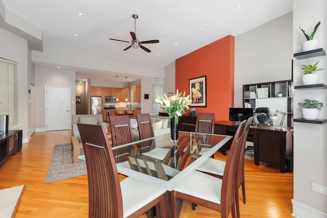 dining room with a ceiling fan, light wood-style floors, recessed lighting, and baseboards