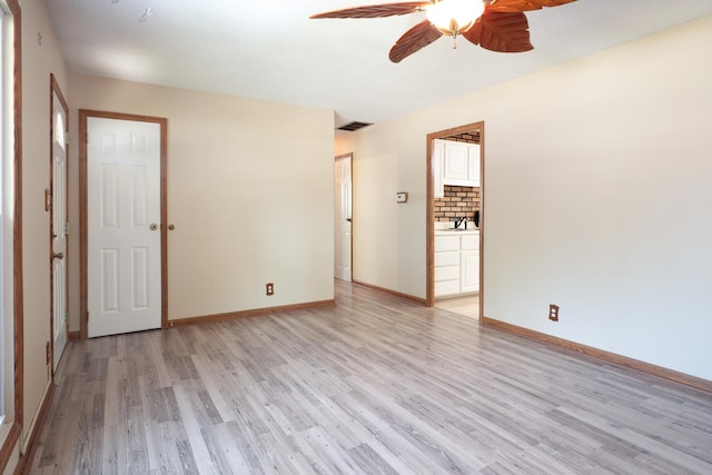 720 Suffolk Pl, Streamwood, IL 60107 - spare room with light wood finished floors and a ceiling fan
