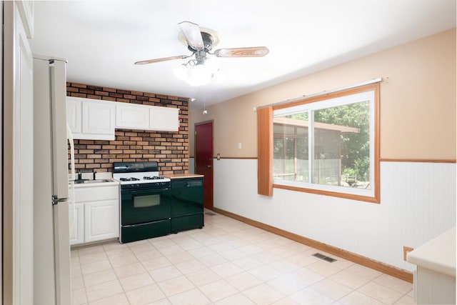 720 Suffolk Pl, Streamwood, IL 60107 - kitchen featuring white appliances, white cabinets, light countertops, ceiling fan, and wainscoting