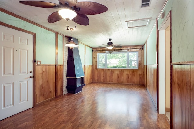 720 Suffolk Pl, Streamwood, IL 60107 - spare room featuring ceiling fan, wood walls, wood finished floors, wainscoting, and crown molding