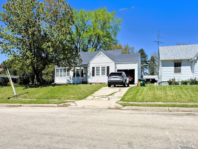 612 W Mason St, Polo, IL 61064 - bungalow-style house featuring an attached garage, driveway, a front yard, and roof with shingles