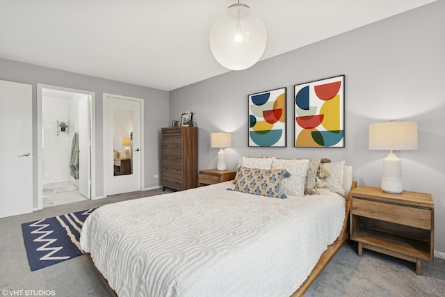 carpeted bedroom featuring ensuite bathroom
