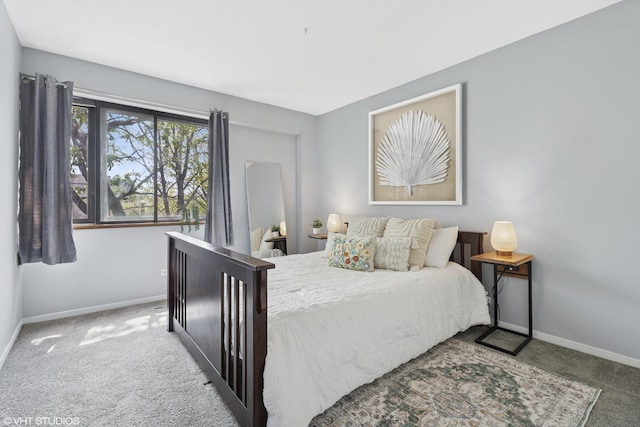 bedroom featuring carpet flooring and baseboards