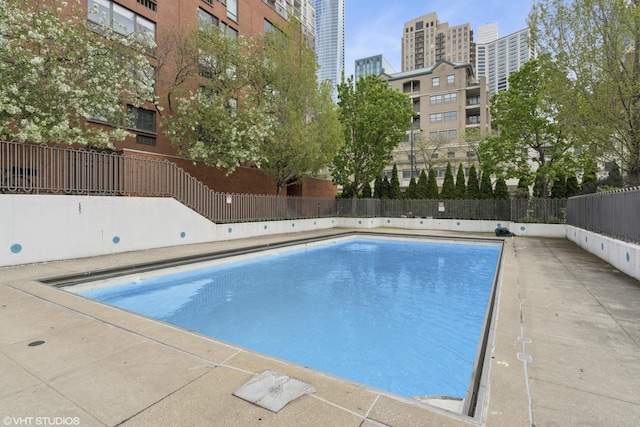 community pool featuring fence