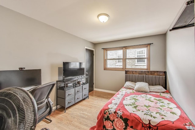 bedroom featuring light wood finished floors
