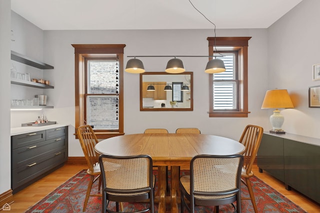 2645 N Mozart St, Chicago, IL 60647 - dining space with plenty of natural light, light wood-type flooring, and baseboards