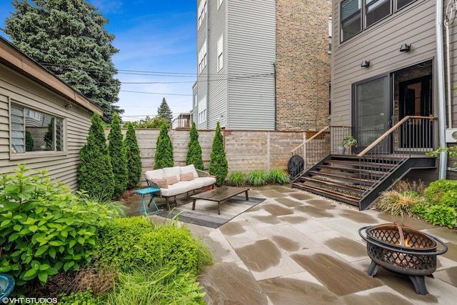 2645 N Mozart St, Chicago, IL 60647 - view of patio / terrace featuring an outdoor fire pit and fence