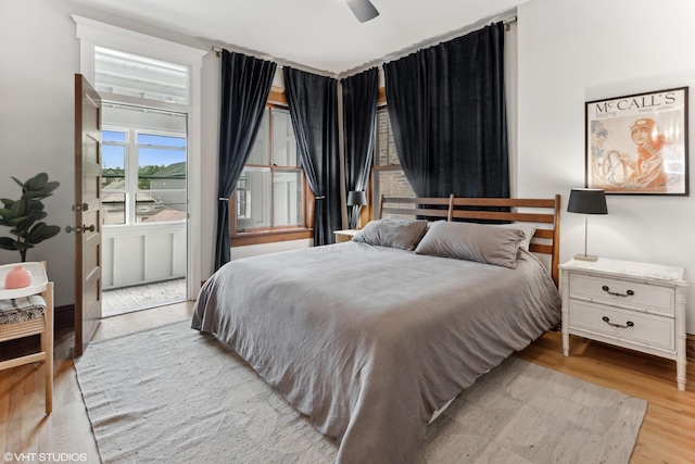 2645 N Mozart St, Chicago, IL 60647 - bedroom with wood finished floors and a ceiling fan