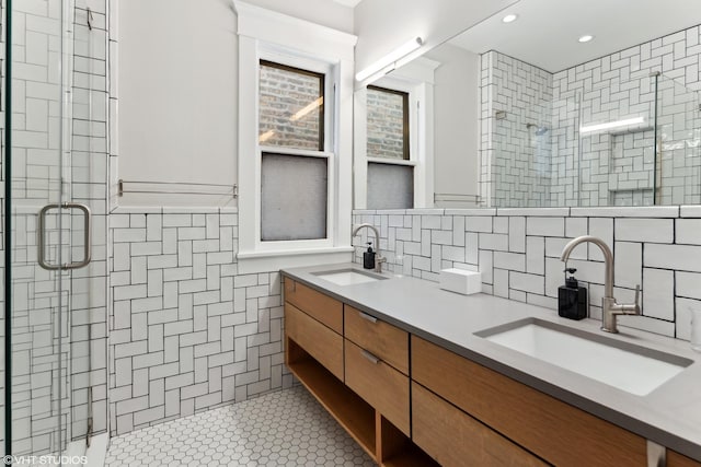 2645 N Mozart St, Chicago, IL 60647 - full bathroom with tile walls, a stall shower, backsplash, double vanity, and tile patterned floors