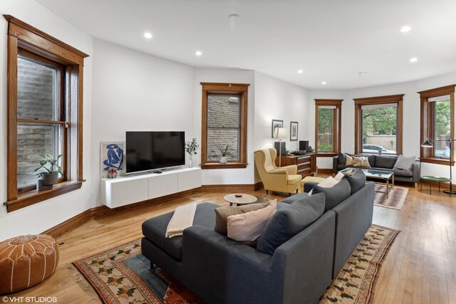 2645 N Mozart St, Chicago, IL 60647 - living room featuring recessed lighting, baseboards, and wood finished floors