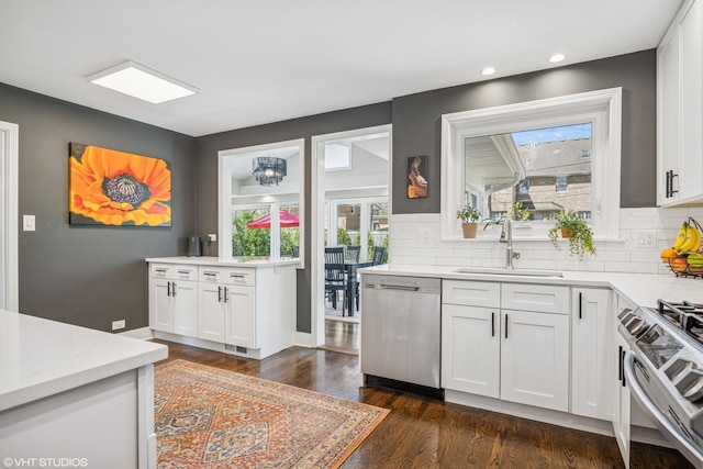 1232 Blackthorn Ln, Deerfield, IL 60015 - kitchen featuring appliances with stainless steel finishes, a sink, healthy amount of natural light, decorative backsplash, and recessed lighting