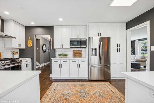 1232 Blackthorn Ln, Deerfield, IL 60015 - kitchen featuring stainless steel appliances, light countertops, white cabinetry, dark wood finished floors, and recessed lighting