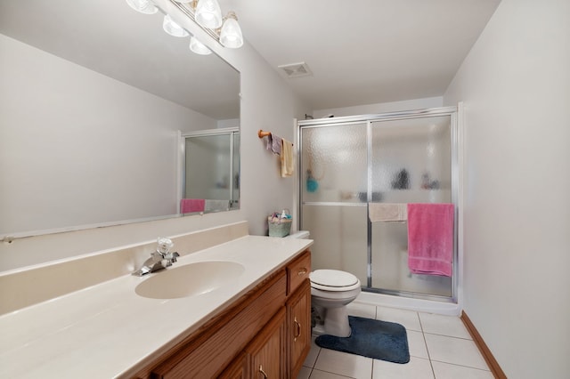 13935 Le Claire Ave Unit 306, Crestwood, IL 60418 - bathroom featuring a stall shower, toilet, and tile patterned flooring