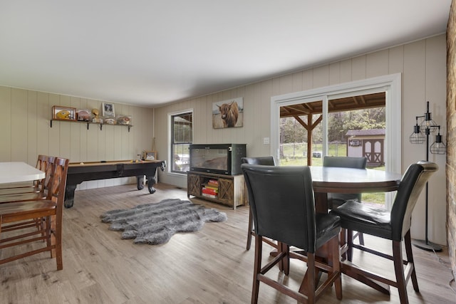 dining space featuring wood finished floors and billiards table