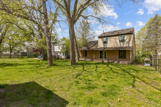 back of property with a porch and board and batten siding