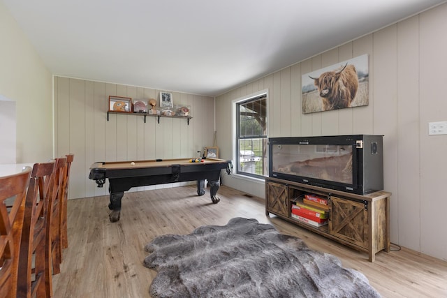 recreation room featuring billiards, wood finished floors, and a decorative wall