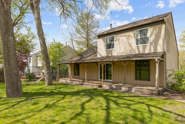 back of house with board and batten siding and a porch