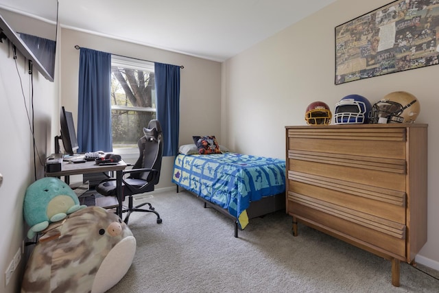 carpeted bedroom with baseboards