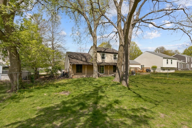 rear view of house with covered porch
