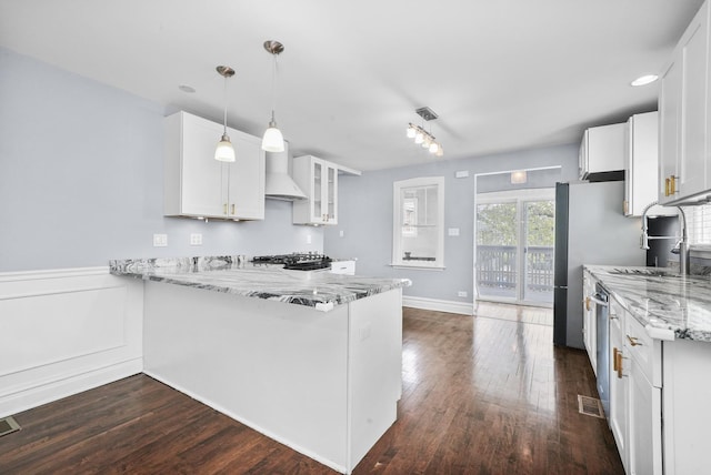 4301 N Melvina Ave, Chicago, IL 60634 - kitchen with wall chimney range hood, a sink, light stone counters, white cabinetry, and glass insert cabinets