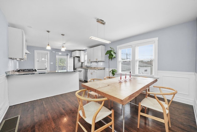 4301 N Melvina Ave, Chicago, IL 60634 - dining space with wainscoting and dark wood-style flooring