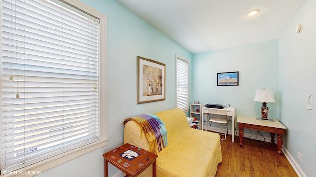 sitting room with wood finished floors, baseboards, and recessed lighting