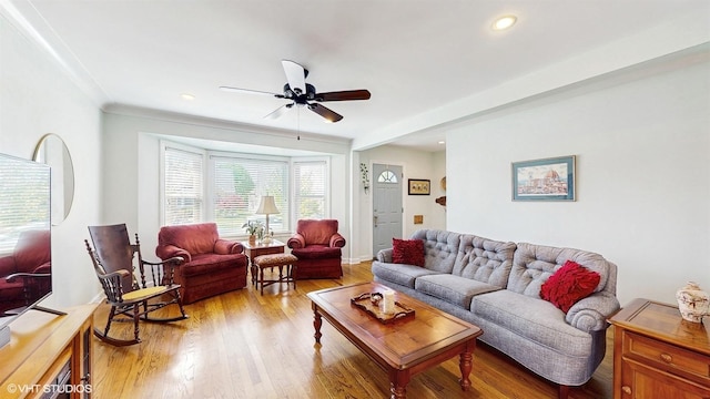 living area featuring a ceiling fan, light wood-type flooring, and recessed lighting